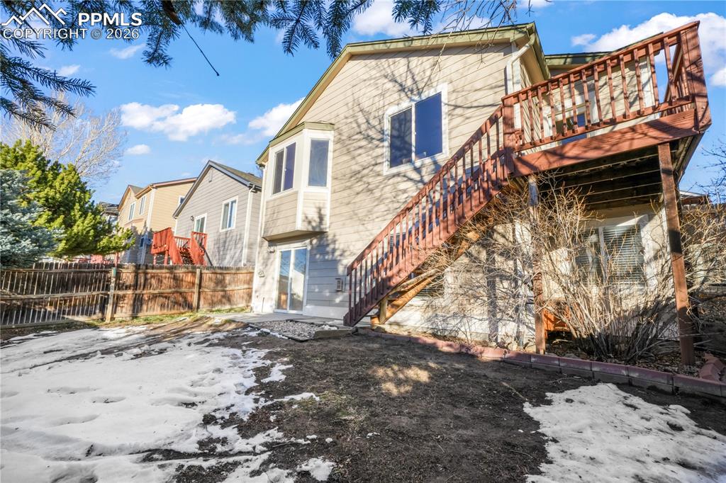 7170 Leeside View Colorado Springs, CO 80922 - Photo 45 of 50 a view of a house with a yard