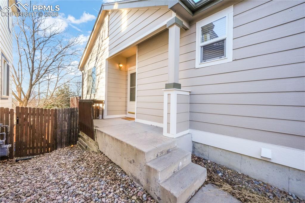 7170 Leeside View Colorado Springs, CO 80922 - Photo 7 of 50 a view of house with backyard and wooden fence
