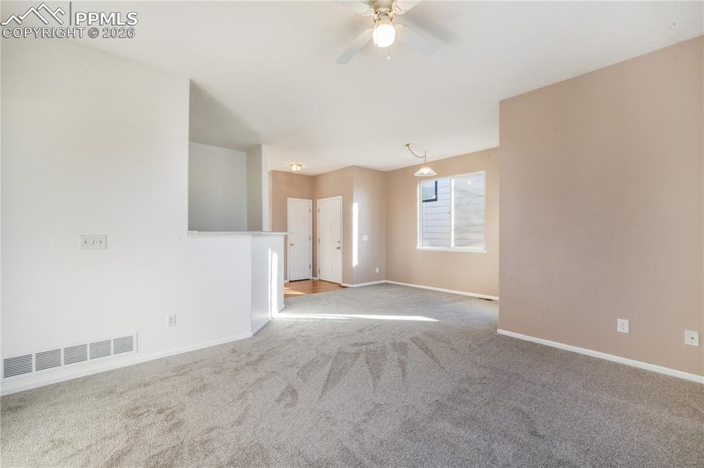 7170 Leeside View Colorado Springs, CO 80922 - Photo 8 of 50 a view of a livingroom with a ceiling fan and window