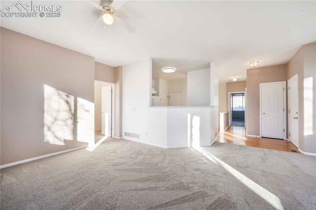 7170 Leeside View Colorado Springs, CO 80922 - Photo 9 of 50 a view of a livingroom with a staircase