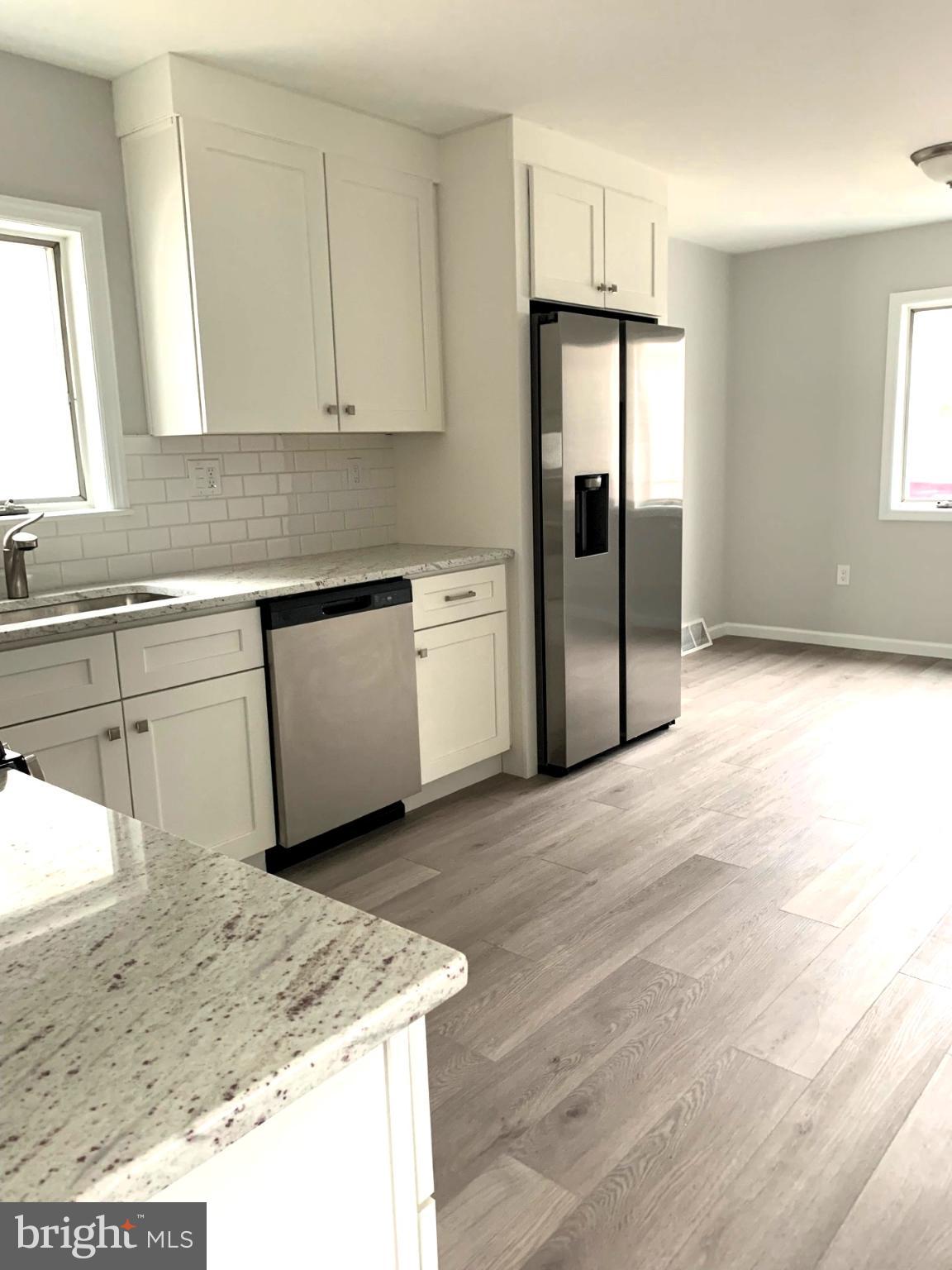 804 South Fairview Street Riverside, NJ 08075 - Photo 4 of 19 a kitchen with stainless steel appliances granite countertop a refrigerator and a sink