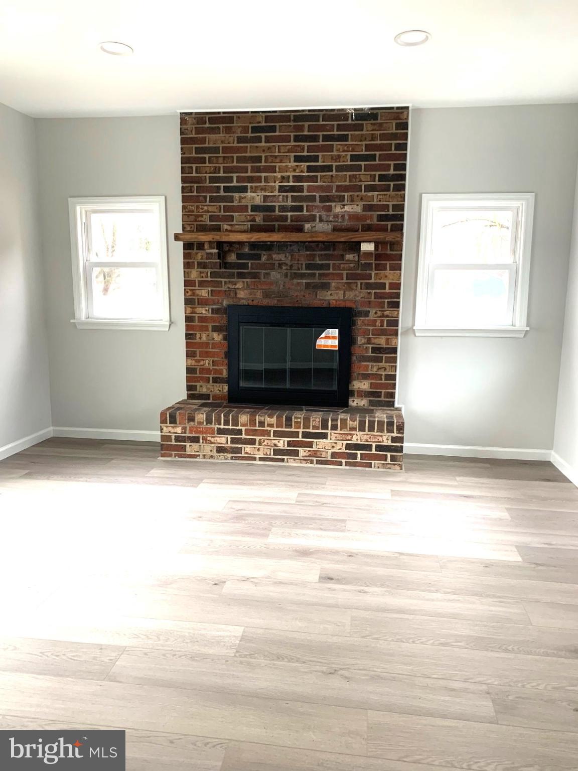804 South Fairview Street Riverside, NJ 08075 - Photo 6 of 19 a living room with a fireplace