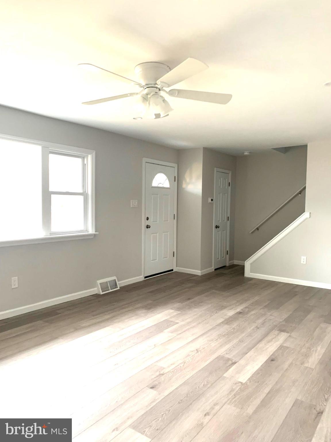 804 South Fairview Street Riverside, NJ 08075 - Photo 8 of 19 an empty room with windows and fan