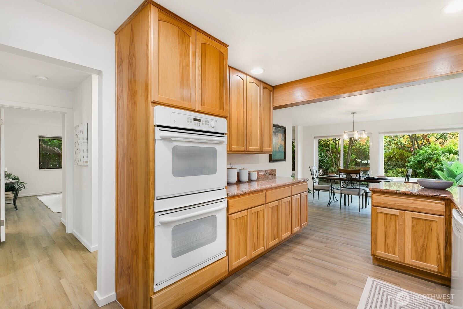 1414 9th Avenue North, Unit 105 Edmonds, WA 98020 - Photo 9 of 35 a kitchen with a stove a sink and a refrigerator