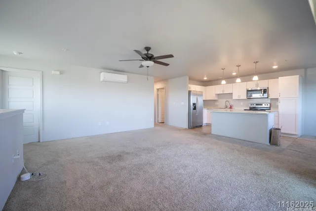 a view of a kitchen with a sink and a refrigerator