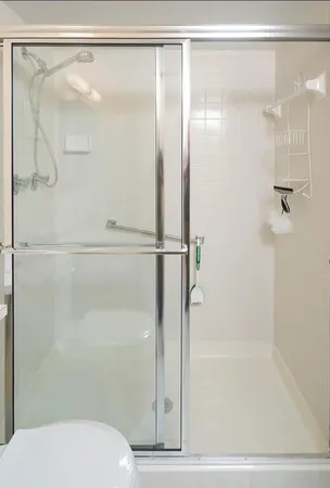 a bathroom with a shower and a toilet