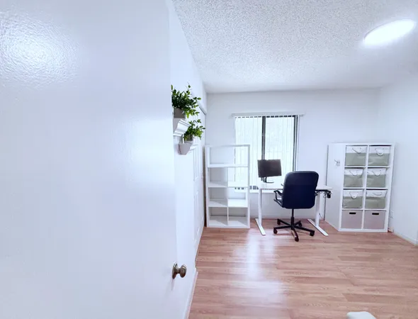 a workspace with furniture and a window