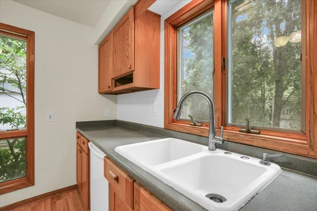 a bathroom with a sink and a window