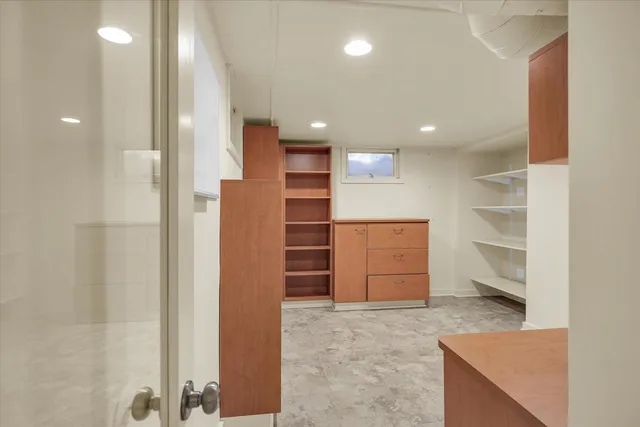 a view of kitchen and refrigerator