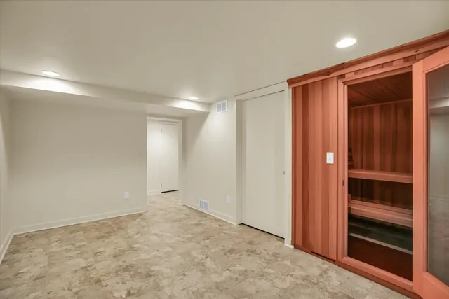 a view of an empty room and an entryway