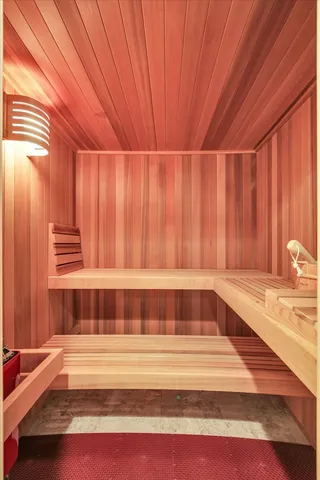 a view of entryway with a bathtub and door