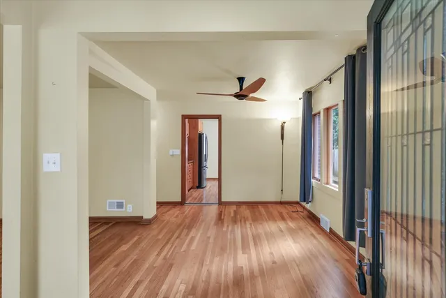 a view of hallway with wooden floor