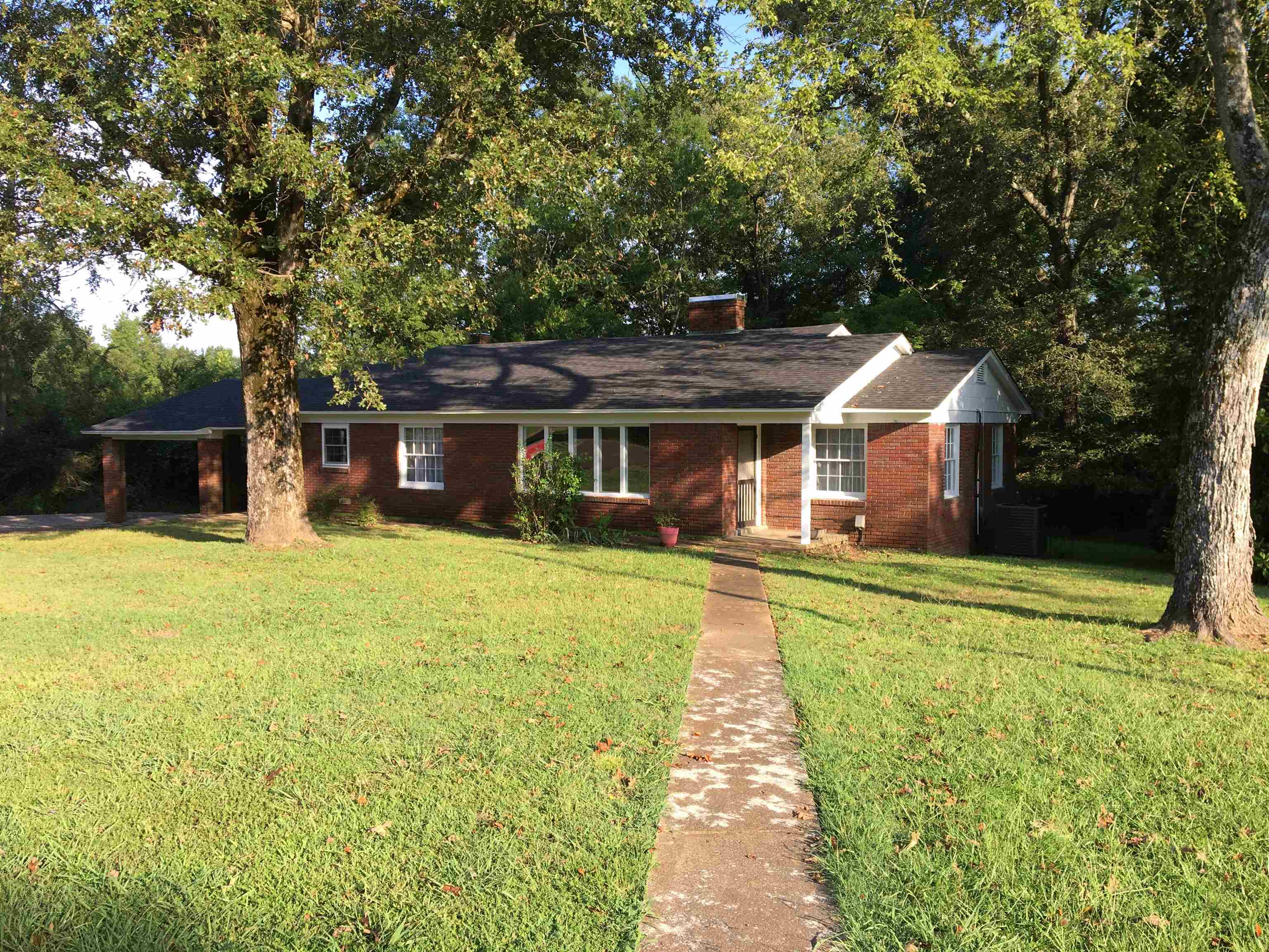 855 Highway 22 Shiloh, TN 38376 - Photo 1 of 24 a front view of a house with a garden