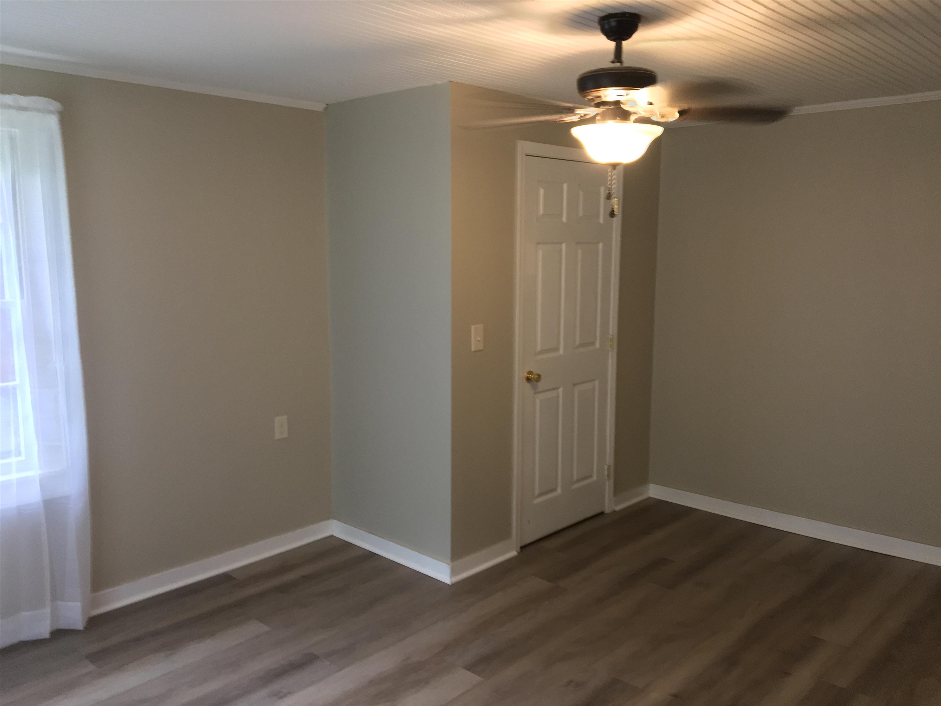 855 Highway 22 Shiloh, TN 38376 - Photo 12 of 24 wooden floor in an empty room with a window