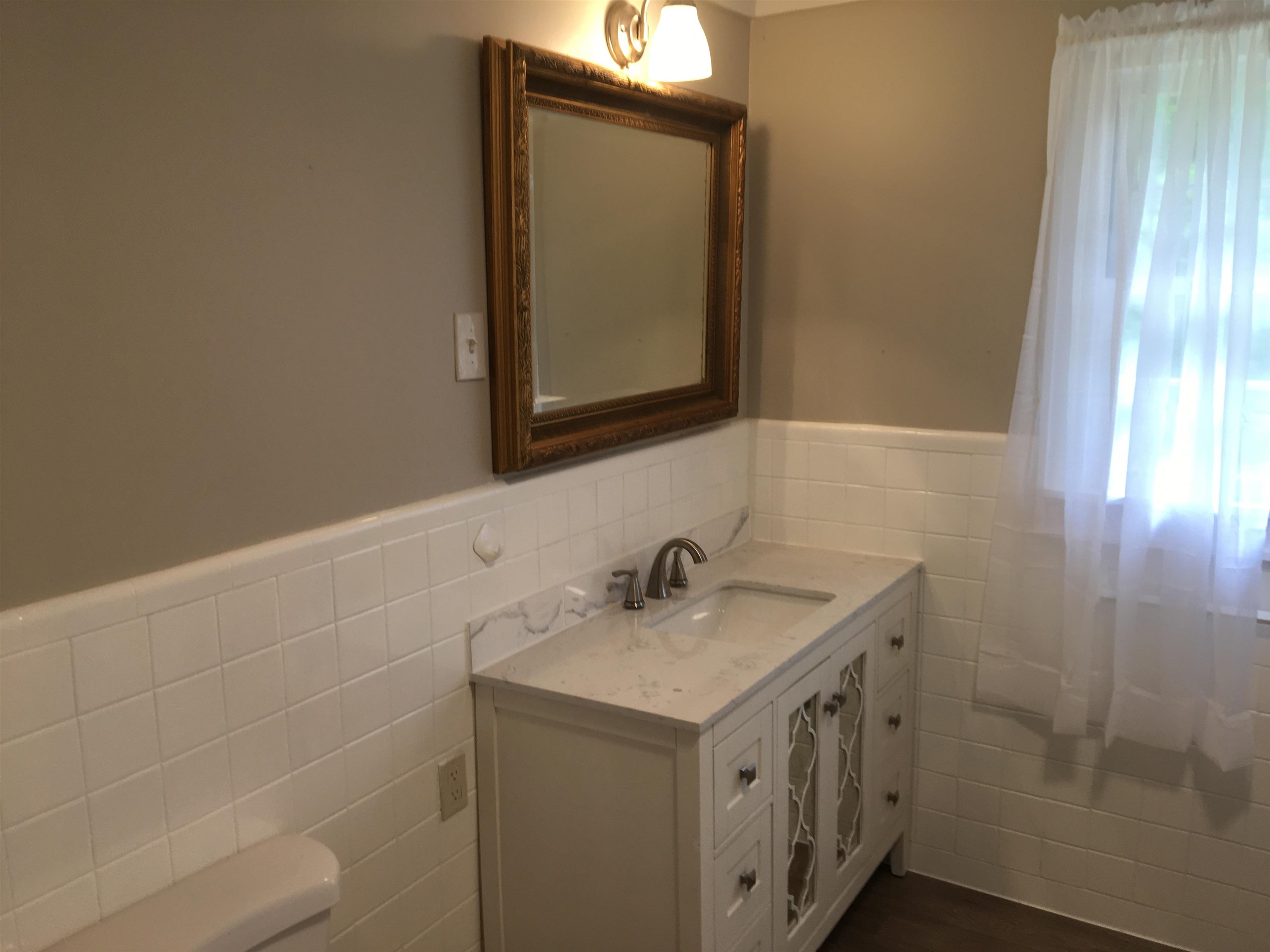 855 Highway 22 Shiloh, TN 38376 - Photo 16 of 24 a bathroom with a sink and a mirror