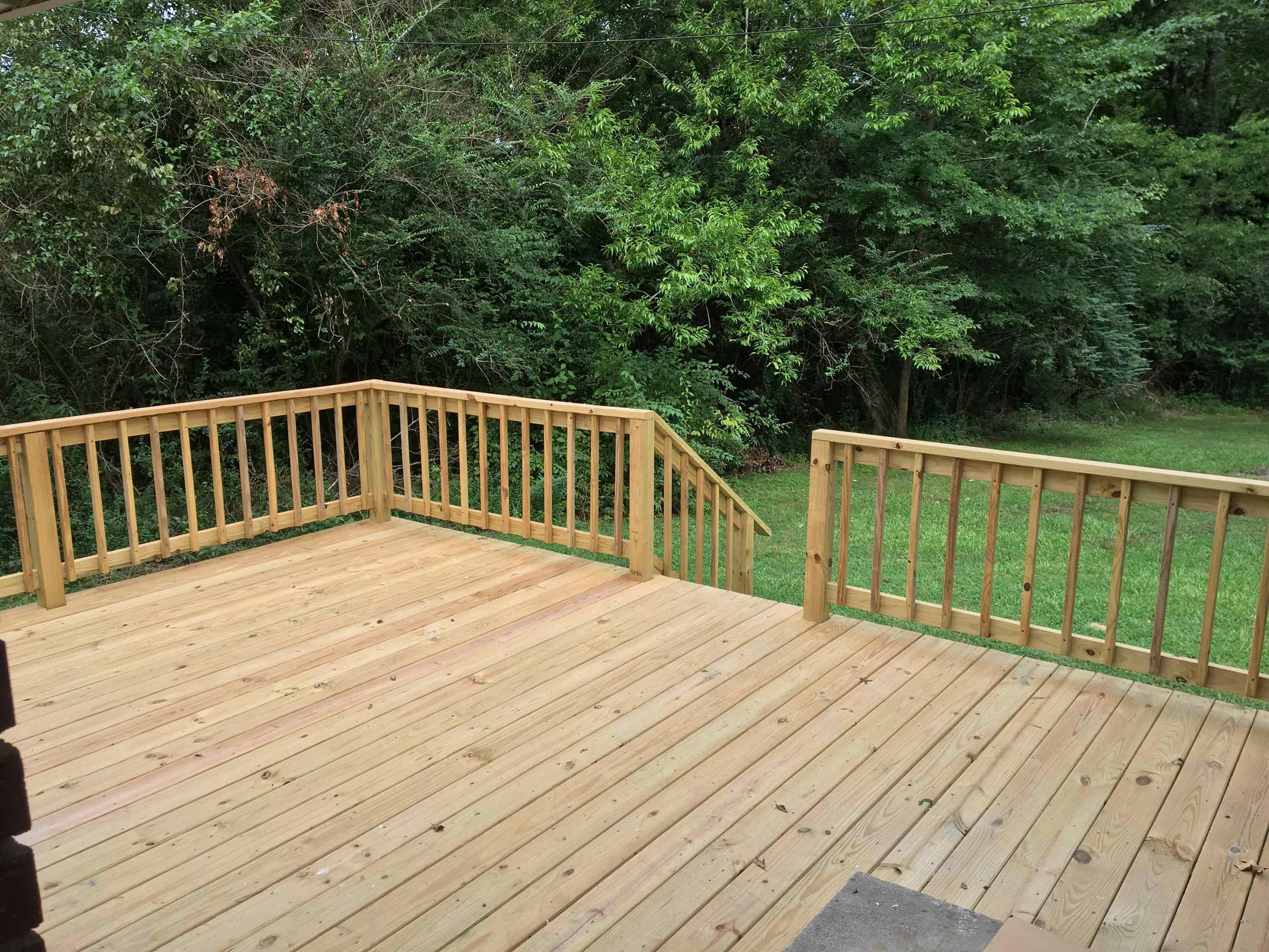 855 Highway 22 Shiloh, TN 38376 - Photo 19 of 24 a view of backyard with wooden floor and fence
