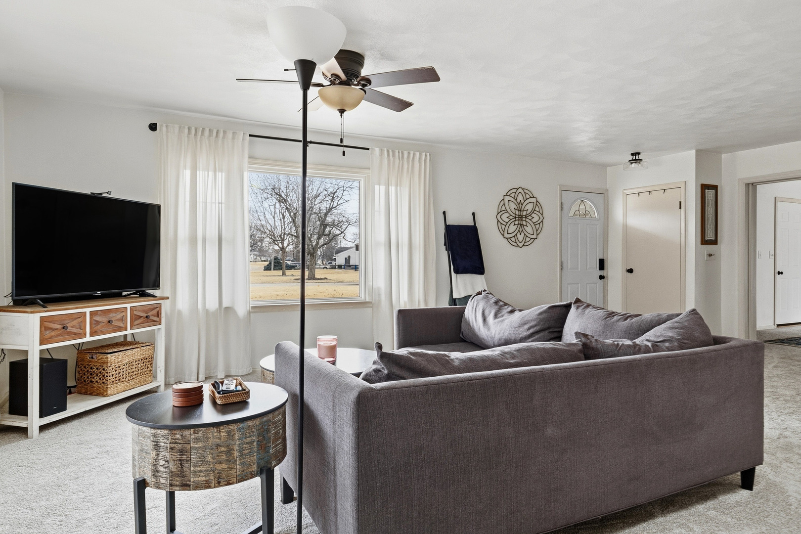 1700 46th Street Moline, IL 61265 - Photo 13 of 45 a living room with furniture and a flat screen tv