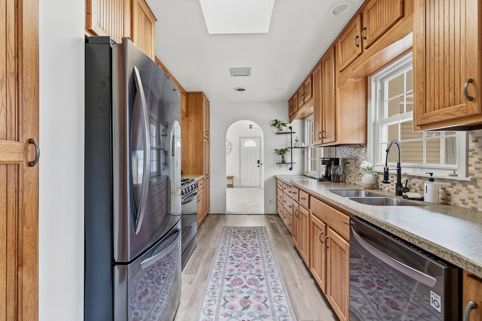 1700 46th Street Moline, IL 61265 - Photo 19 of 45 a kitchen with stainless steel appliances granite countertop a refrigerator and a sink