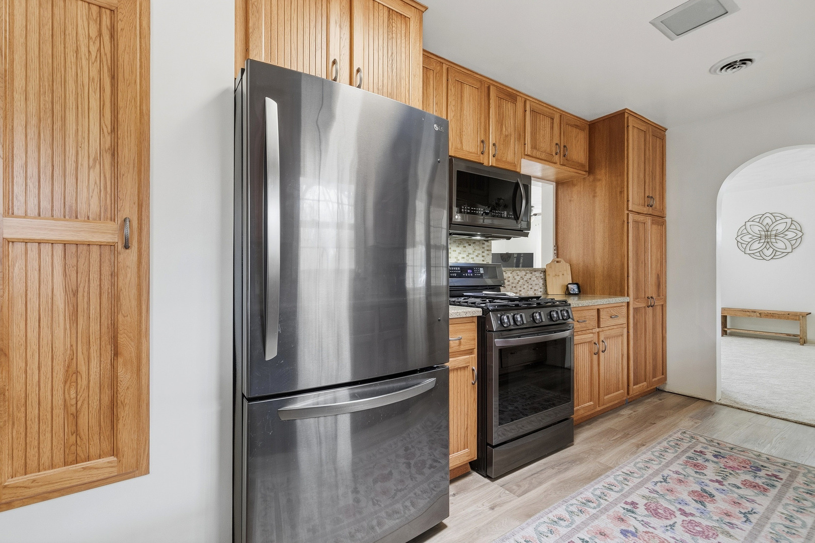 1700 46th Street Moline, IL 61265 - Photo 20 of 45 a kitchen with stainless steel appliances granite countertop a refrigerator stove and a sink