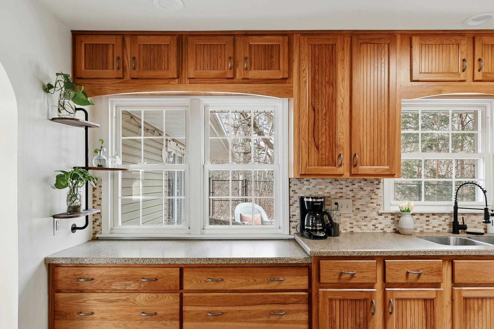 1700 46th Street Moline, IL 61265 - Photo 22 of 45 a kitchen with granite countertop a sink stainless steel appliances cabinets and a window