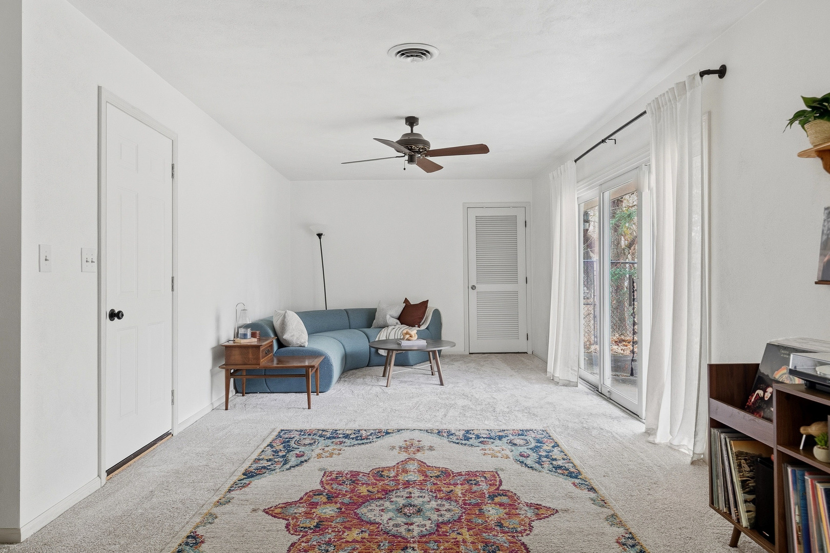 1700 46th Street Moline, IL 61265 - Photo 25 of 45 a living room with furniture a ceiling fan and a rug