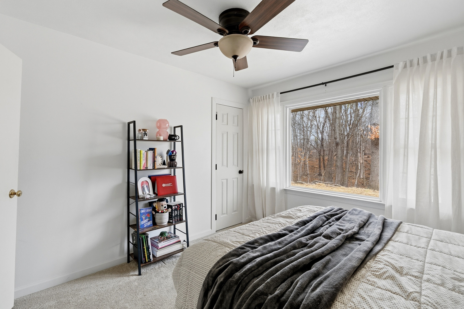 1700 46th Street Moline, IL 61265 - Photo 33 of 45 a bedroom with a bed and a book shelf