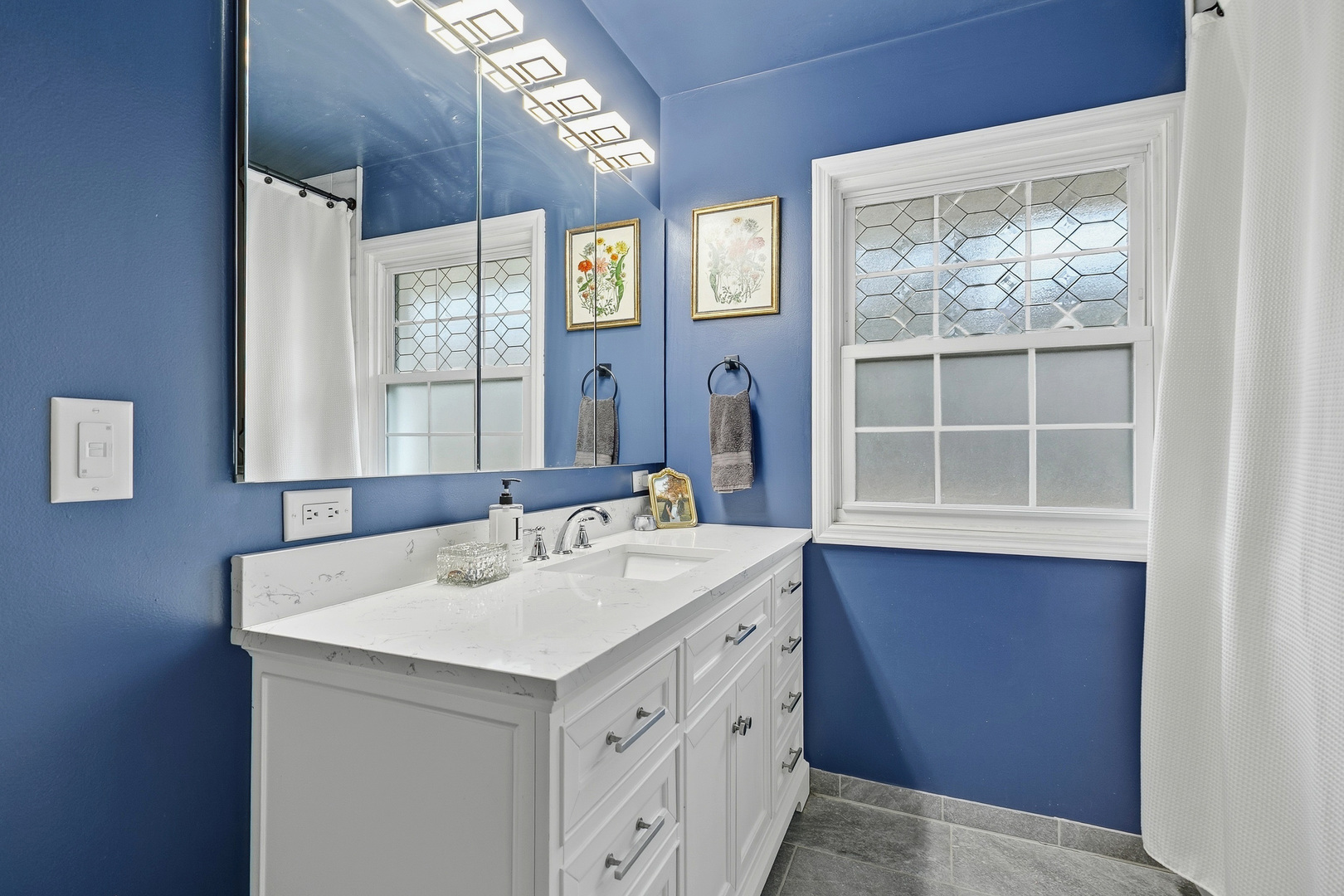 1700 46th Street Moline, IL 61265 - Photo 36 of 45 a bathroom with a sink a vanity and a mirror