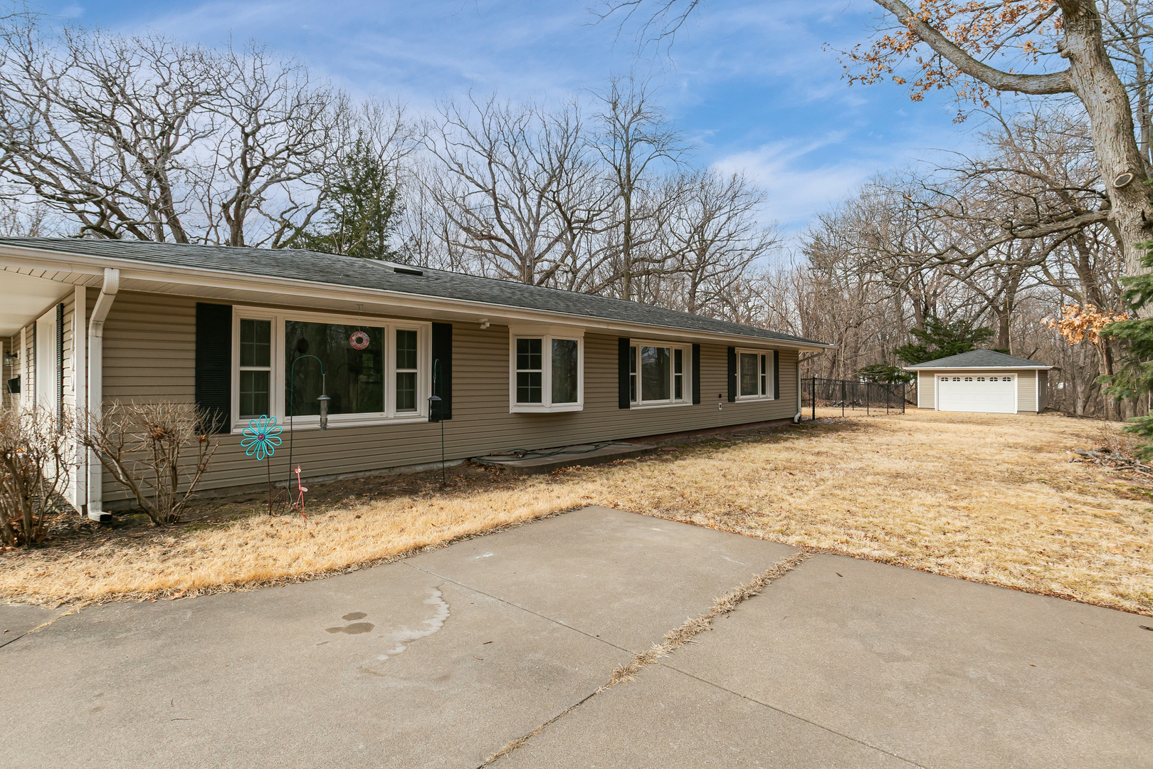 1700 46th Street Moline, IL 61265 - Photo 4 of 45 a house with trees in front of it