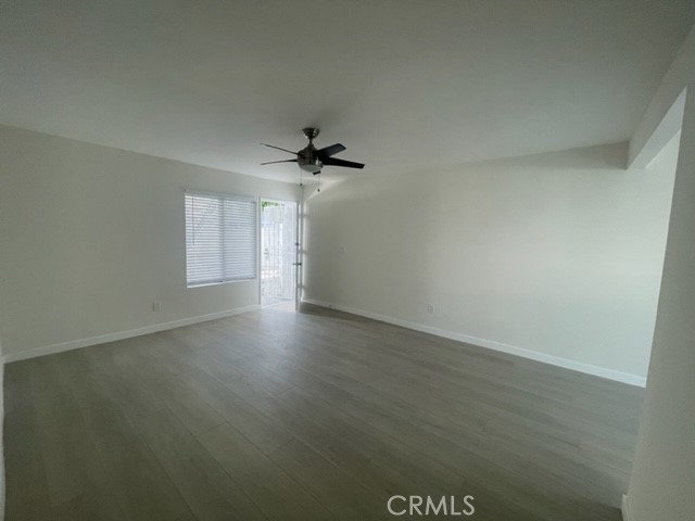 17061 Grove Circle, Unit 4 Huntington Beach, CA 92647 - Photo 11 of 15 wooden floor in an empty room