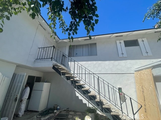 17061 Grove Circle, Unit 4 Huntington Beach, CA 92647 - Photo 2 of 15 a view of entryway with wooden floor