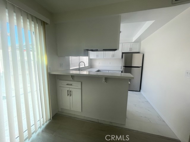 17061 Grove Circle, Unit 4 Huntington Beach, CA 92647 - Photo 5 of 15 a utility room with washer and dryer