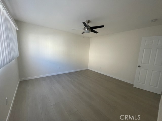 17061 Grove Circle, Unit 4 Huntington Beach, CA 92647 - Photo 7 of 15 an empty room with a workbench