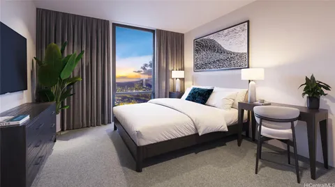 a bedroom with a large bed and a potted plant