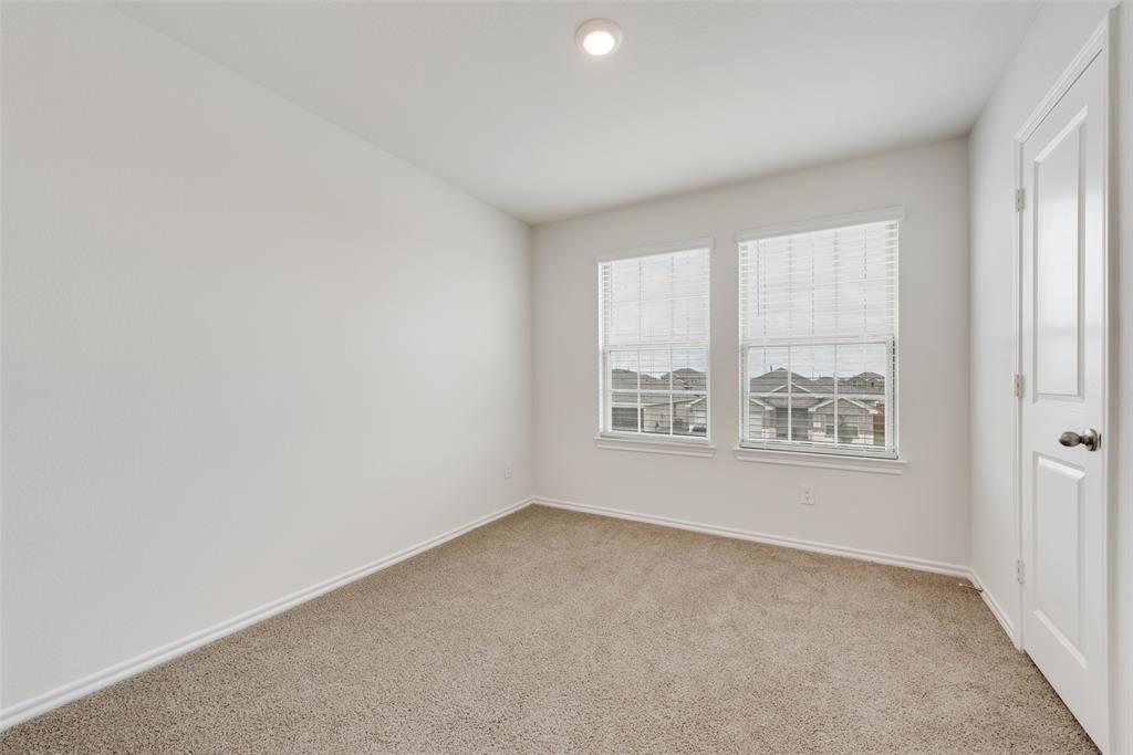 1428 Millstead Rill Drive Caddo Mills, TX 75135 - Photo 21 of 24 an empty room with windows