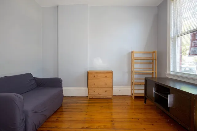 a living room with furniture and a gate