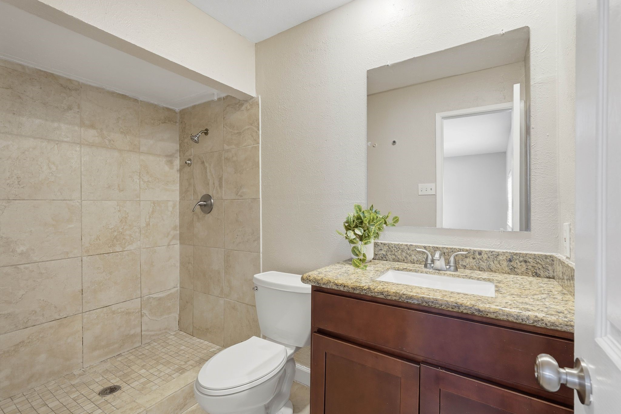 17223 Ranch Country Road Hockley, TX 77447 - Photo 27 of 36 Your primary bathroom has a large walk in shower to make getting ready in the morning a breeze. Now it's time to go check out your backyard.