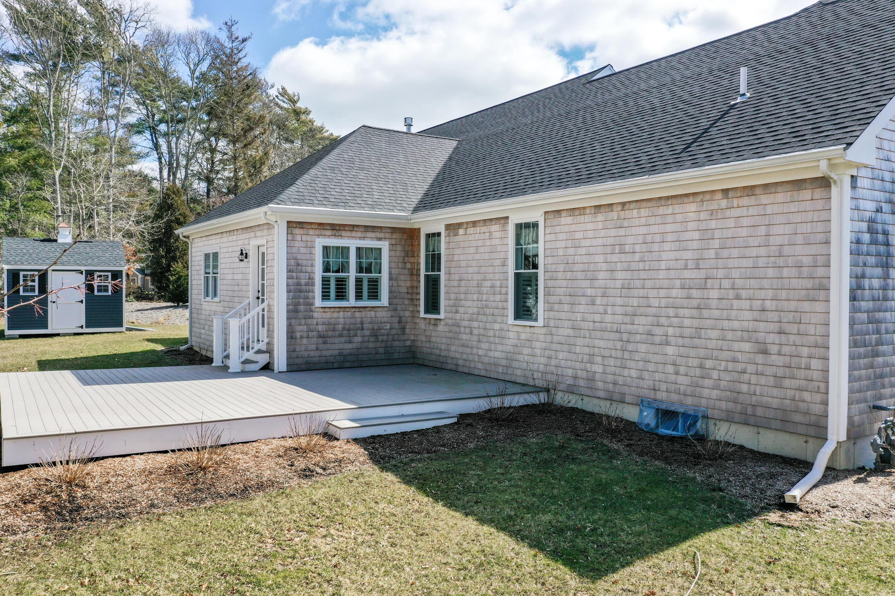 127 Elgin Road Pocasset, MA 02559 - Photo 8 of 40 a view of a house with a yard