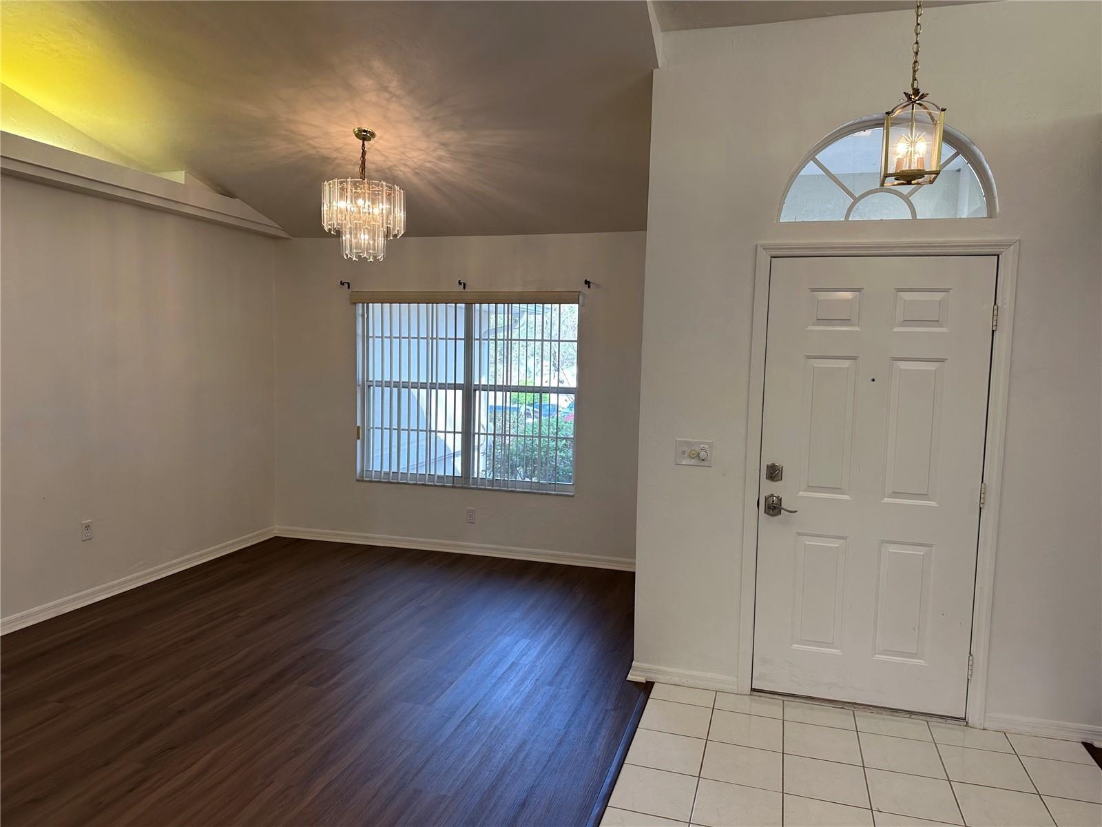 1435 Northwest 100th Terrace Gainesville, FL 32606 - Photo 5 of 20 wooden floor in an empty room with a window