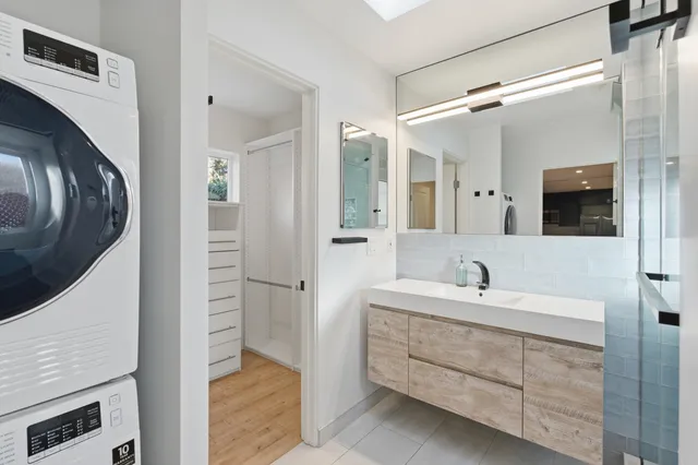 a view of a room with wooden floor and cabinet