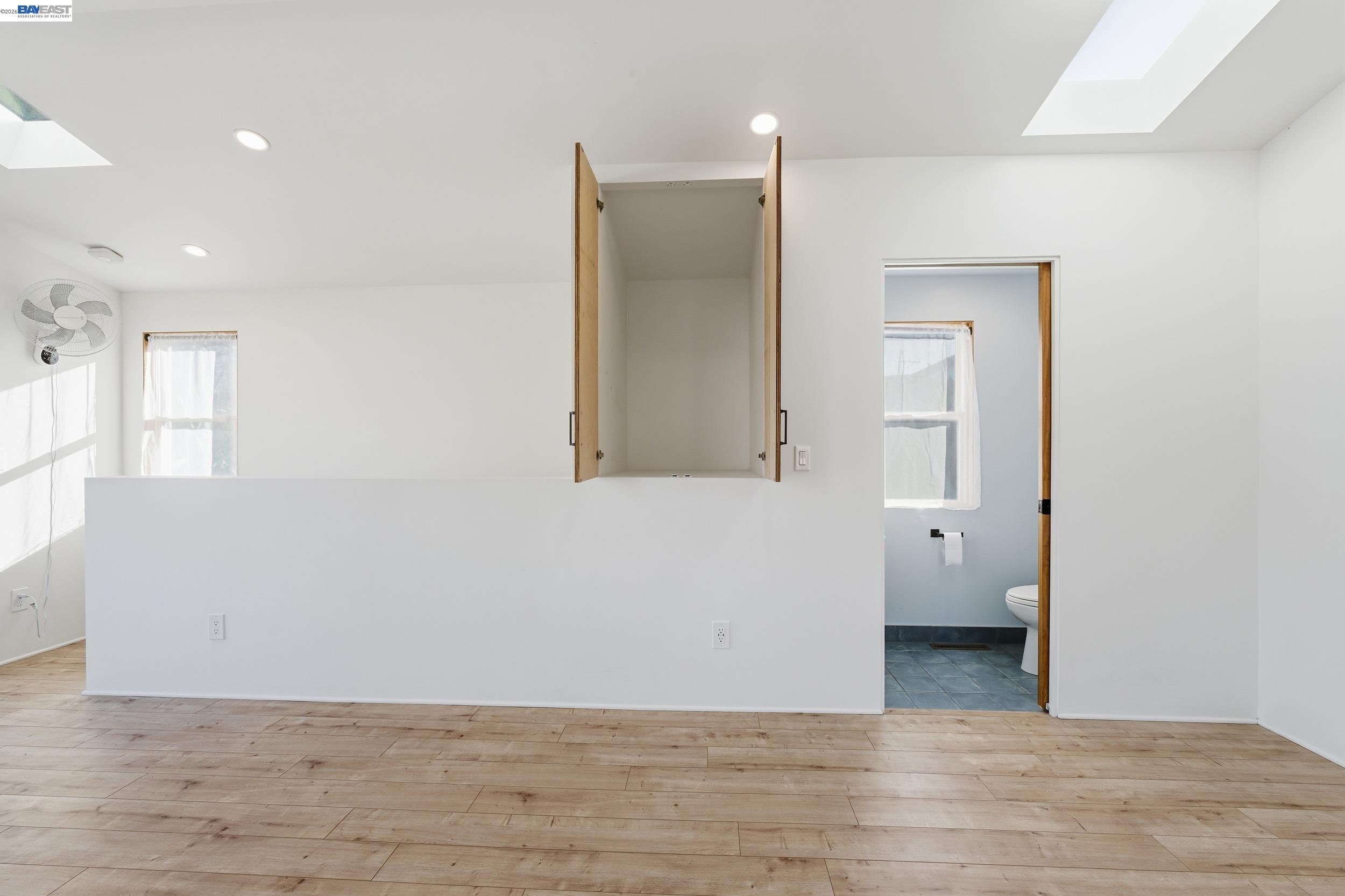 820 46th Street Oakland, CA 94608 - Photo 17 of 34 a view of a room with wooden floor and cabinet