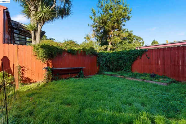 a backyard of a house with lots of green space