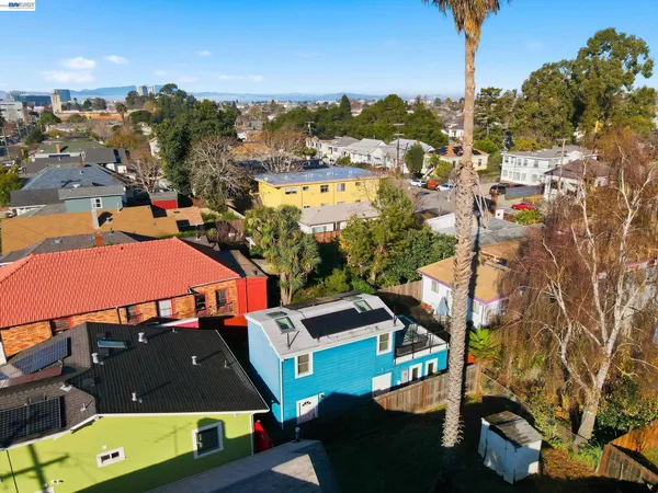 an aerial view of a house with a swimming pool