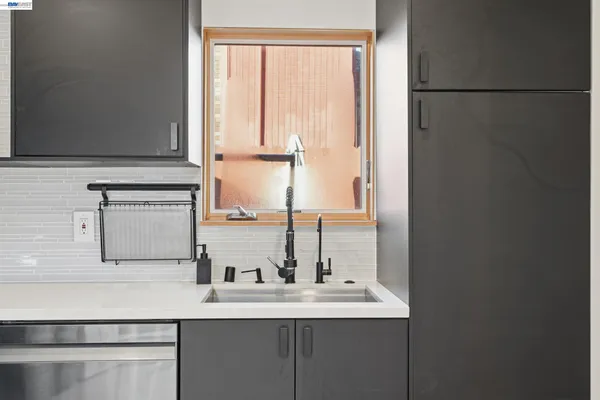 a kitchen with a sink and a window