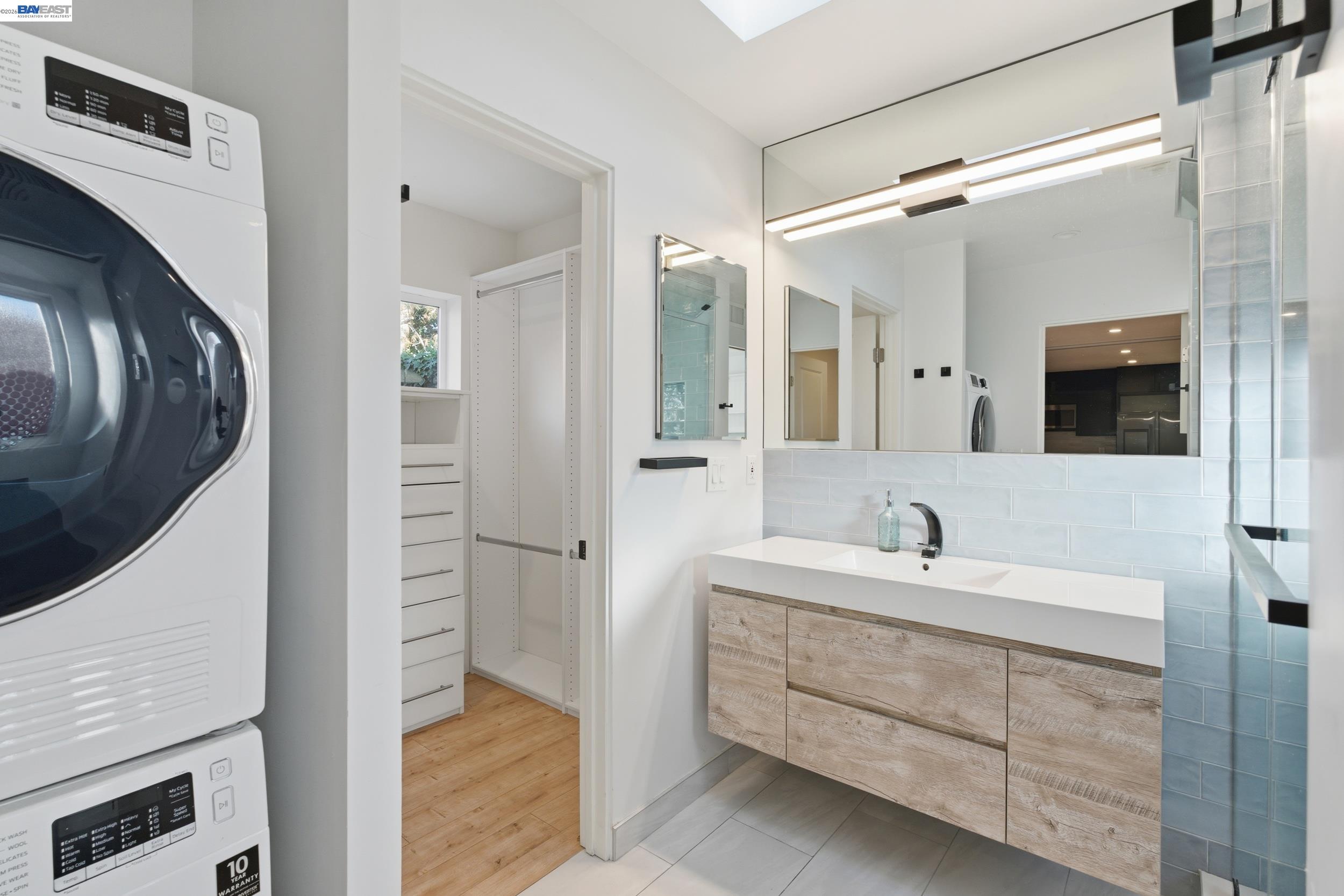 820 46th Street Oakland, CA 94608 - Photo 10 of 34 a bathroom with a sink and a mirror