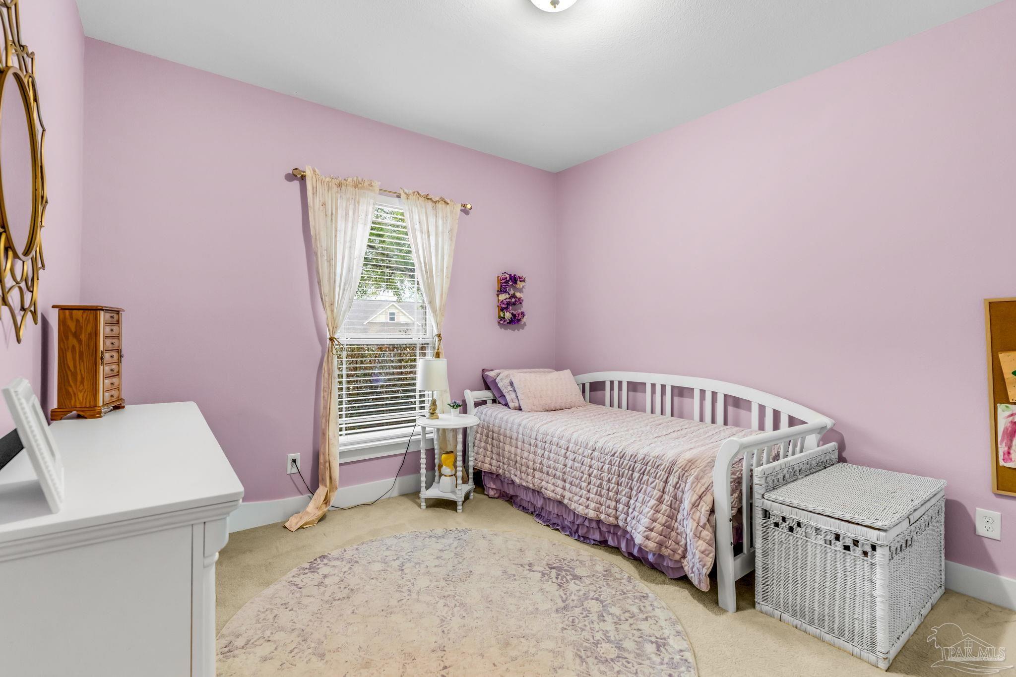 8606 Foxtail Loop Pensacola, FL 32526 - Photo 20 of 57 a bedroom with a bed and a window