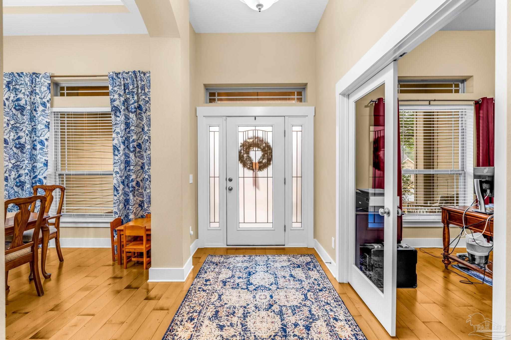 8606 Foxtail Loop Pensacola, FL 32526 - Photo 2 of 57 a view of an entryway with dining area