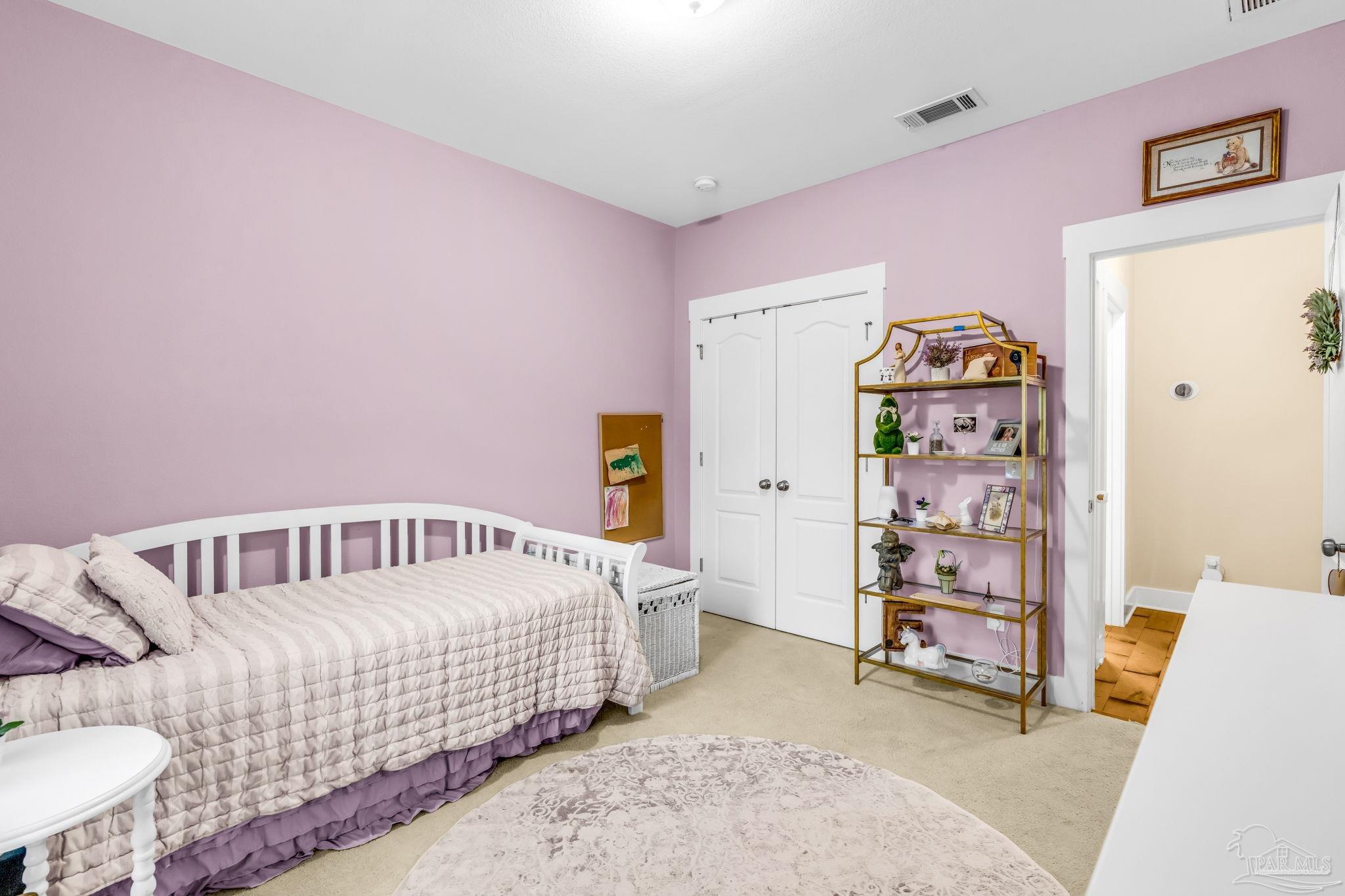 8606 Foxtail Loop Pensacola, FL 32526 - Photo 21 of 57 a bedroom with furniture and a baby crib