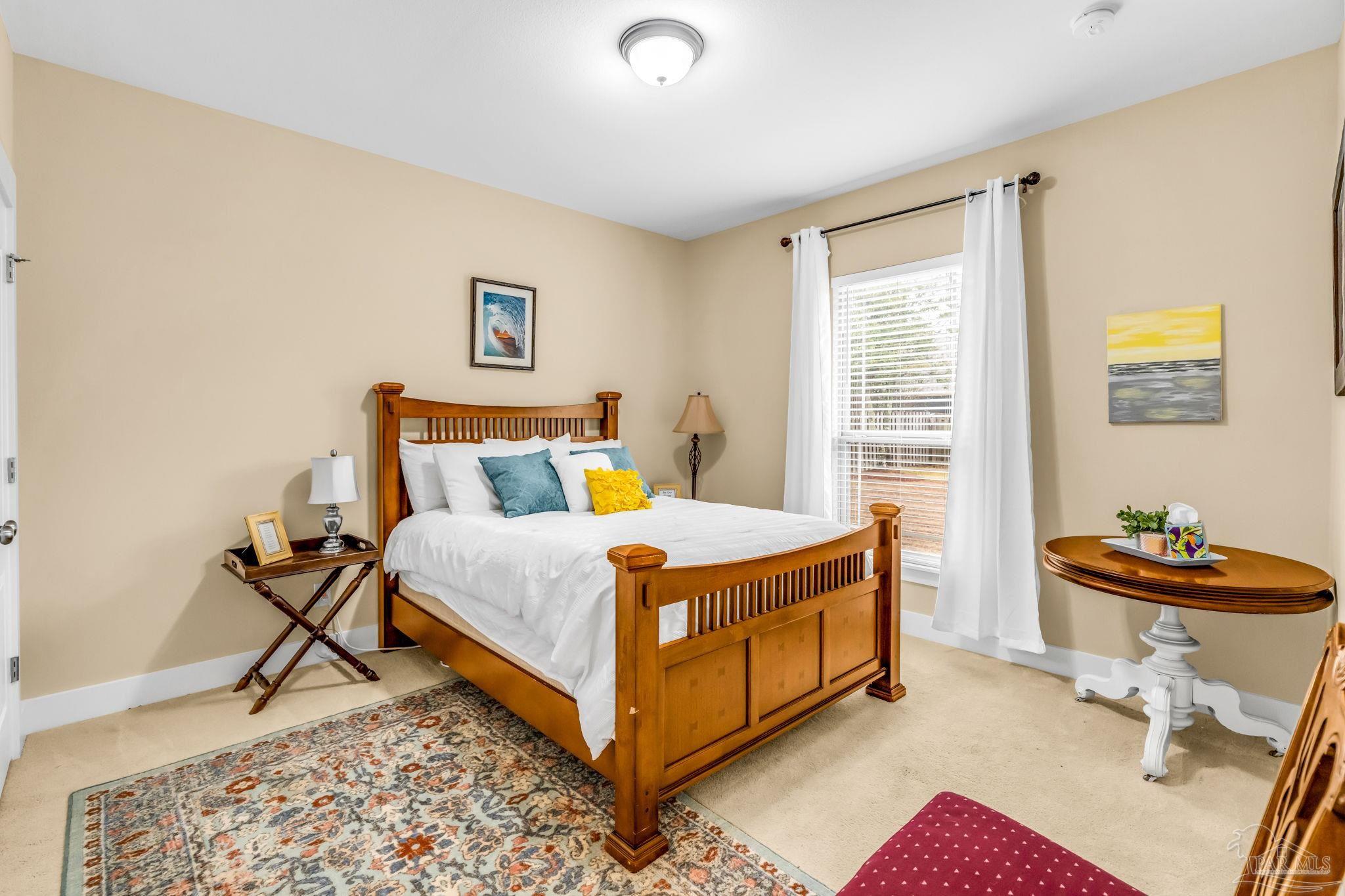 8606 Foxtail Loop Pensacola, FL 32526 - Photo 22 of 57 a bed room with a bed and a chair