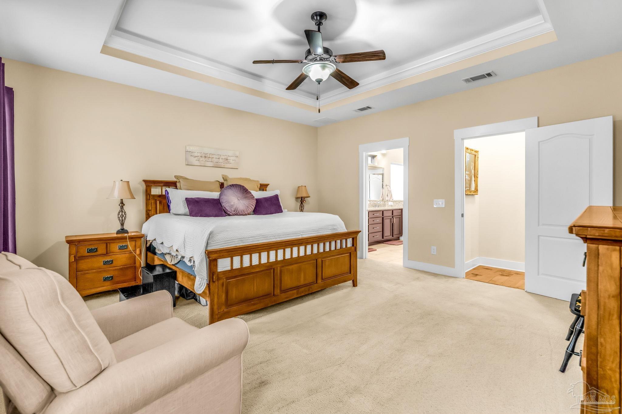 8606 Foxtail Loop Pensacola, FL 32526 - Photo 24 of 57 a bedroom with furniture and a chandelier