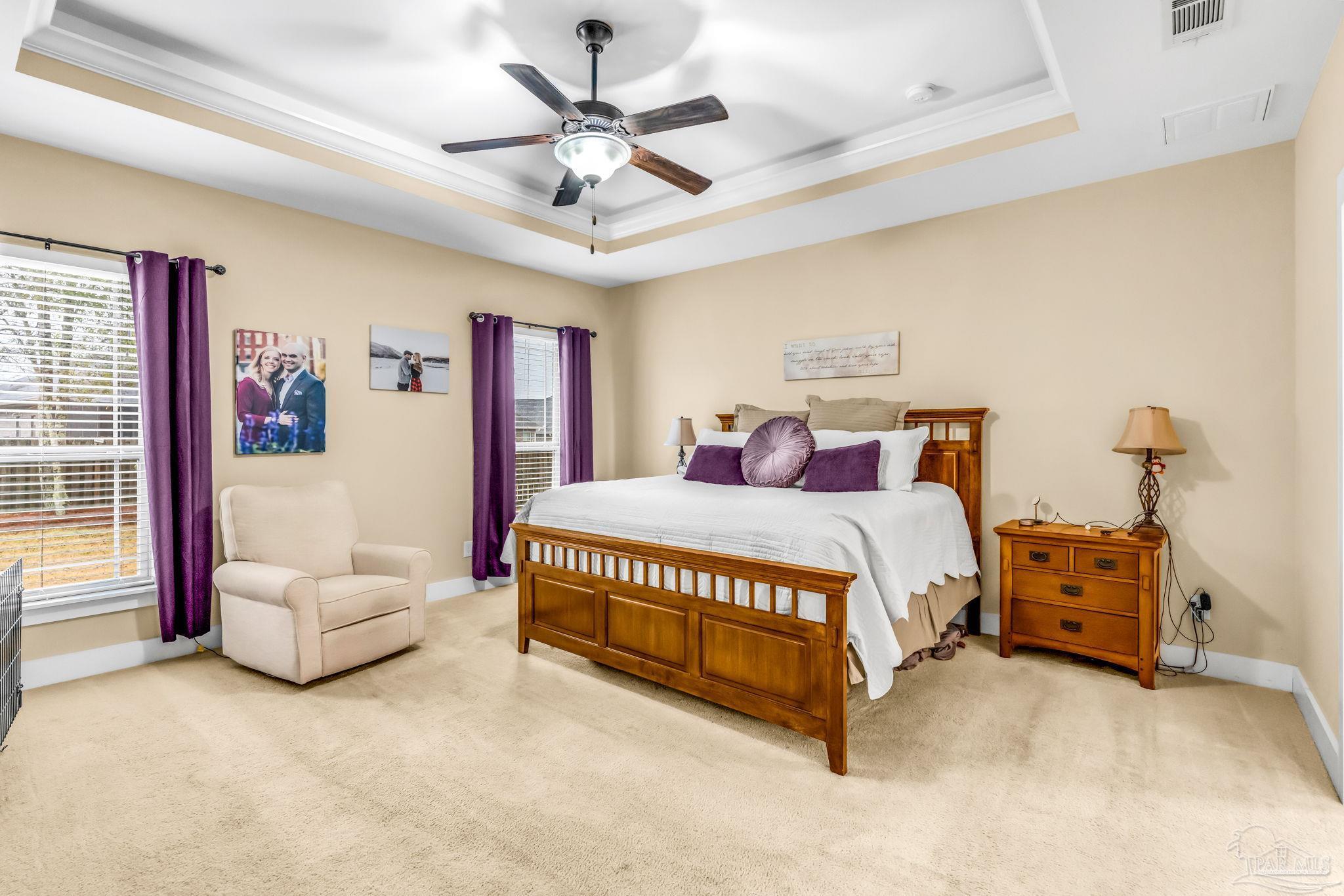8606 Foxtail Loop Pensacola, FL 32526 - Photo 25 of 57 a spacious bedroom with a bed and a couch